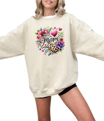a woman wearing a sweatshirt that says best mom ever