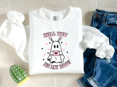 a white t - shirt with a cartoon ghost on it