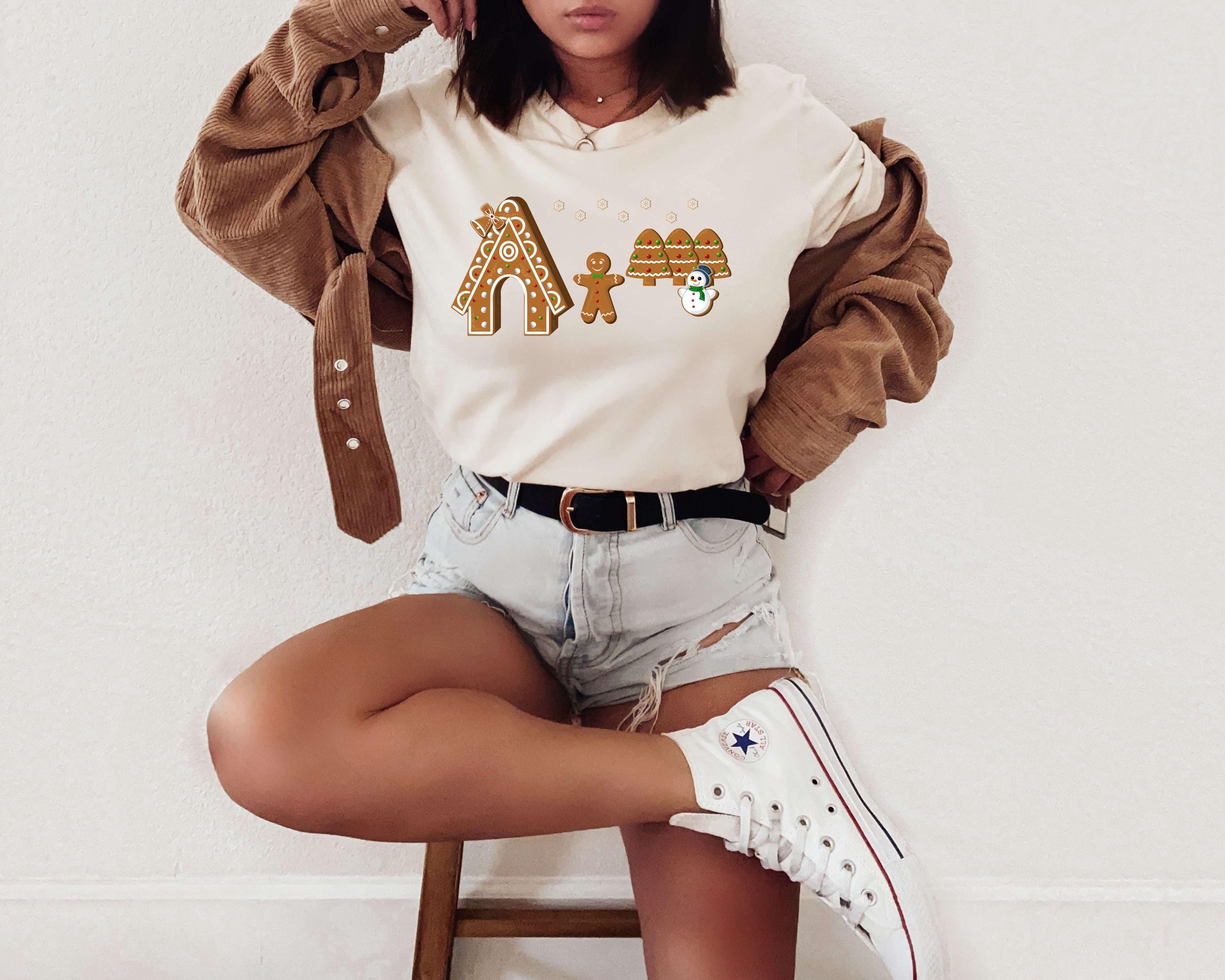 a woman sitting on top of a wooden stool