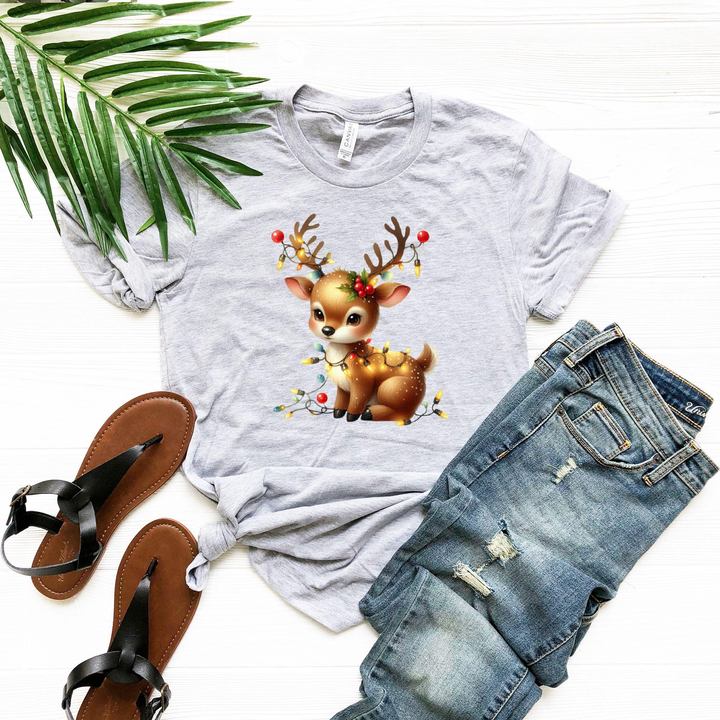 a t - shirt with a deer and christmas lights on it