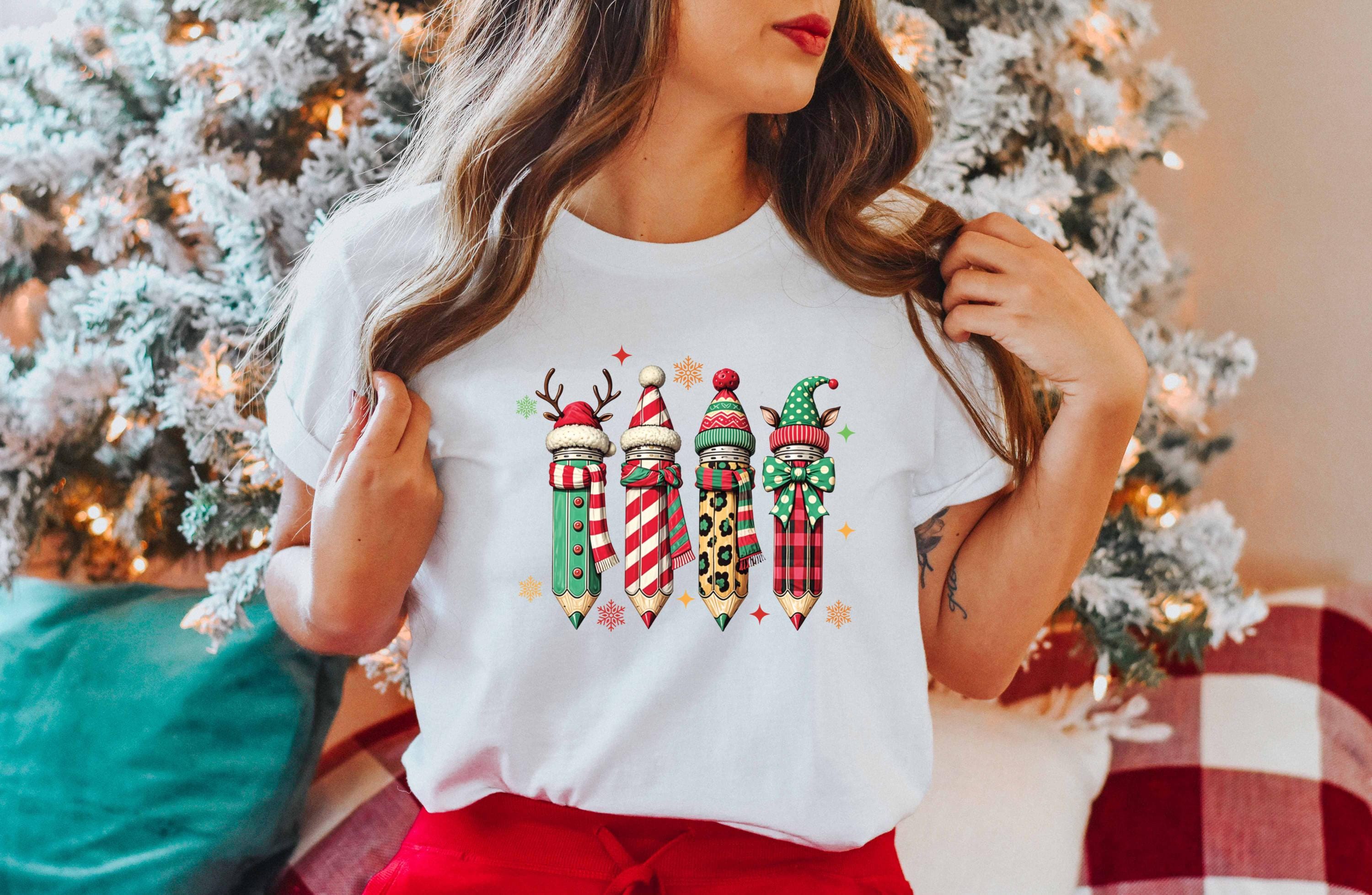 a woman standing in front of a christmas tree