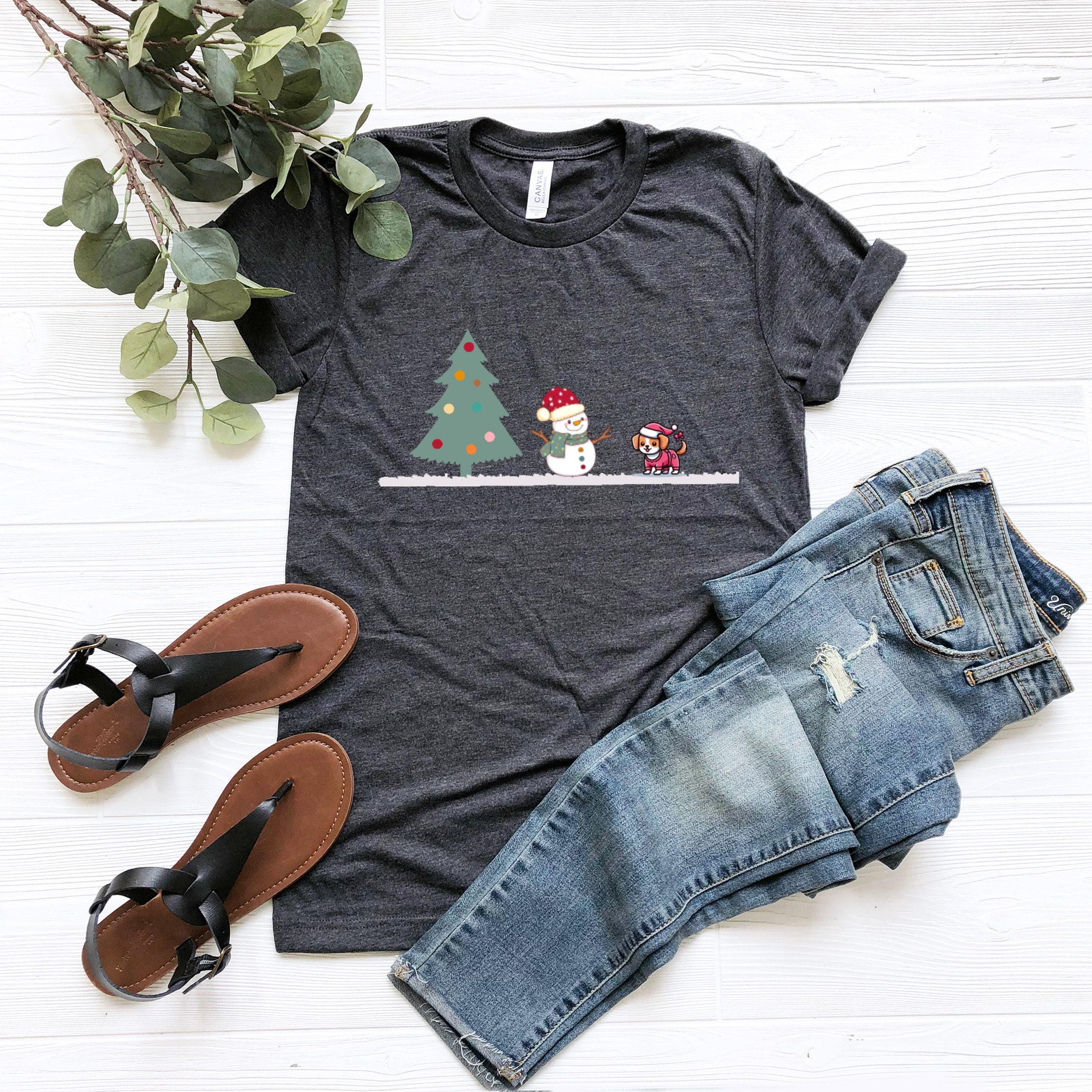 a t - shirt with a christmas tree and two snowmen on it