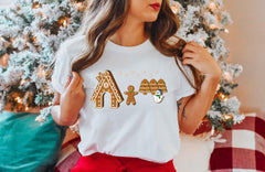 a woman standing in front of a christmas tree