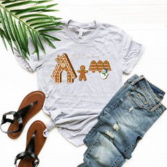 a t - shirt with ginger cookies on it next to a pair of jeans