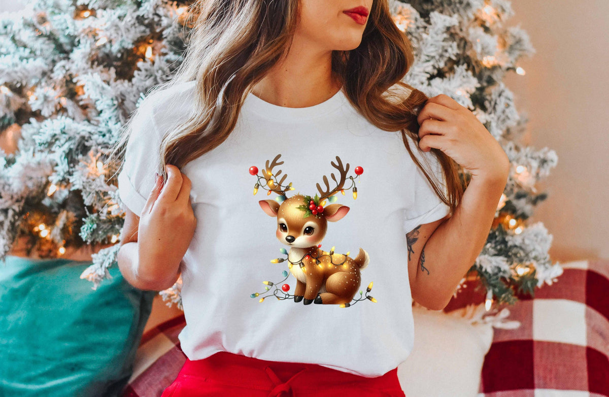 a woman wearing a white t - shirt with a deer on it