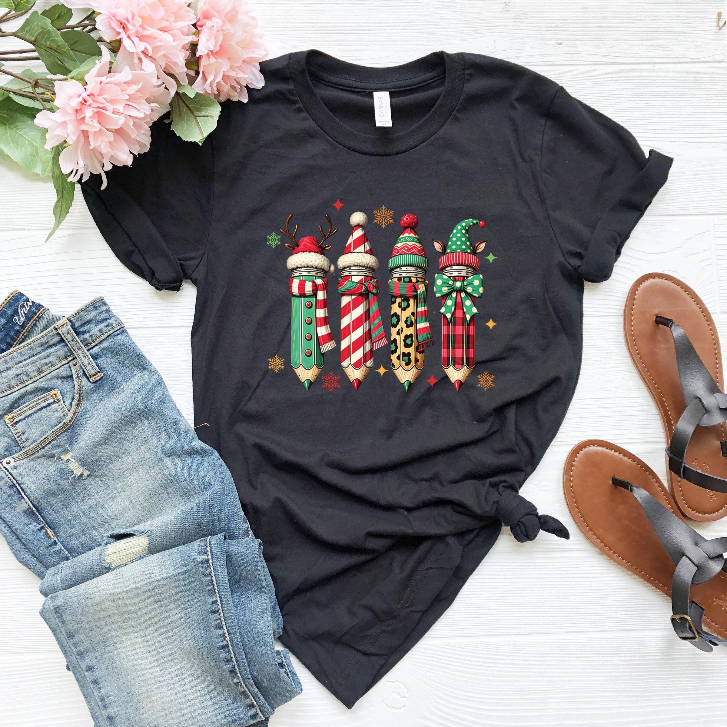 a black t - shirt with candy canes and candy canes on it