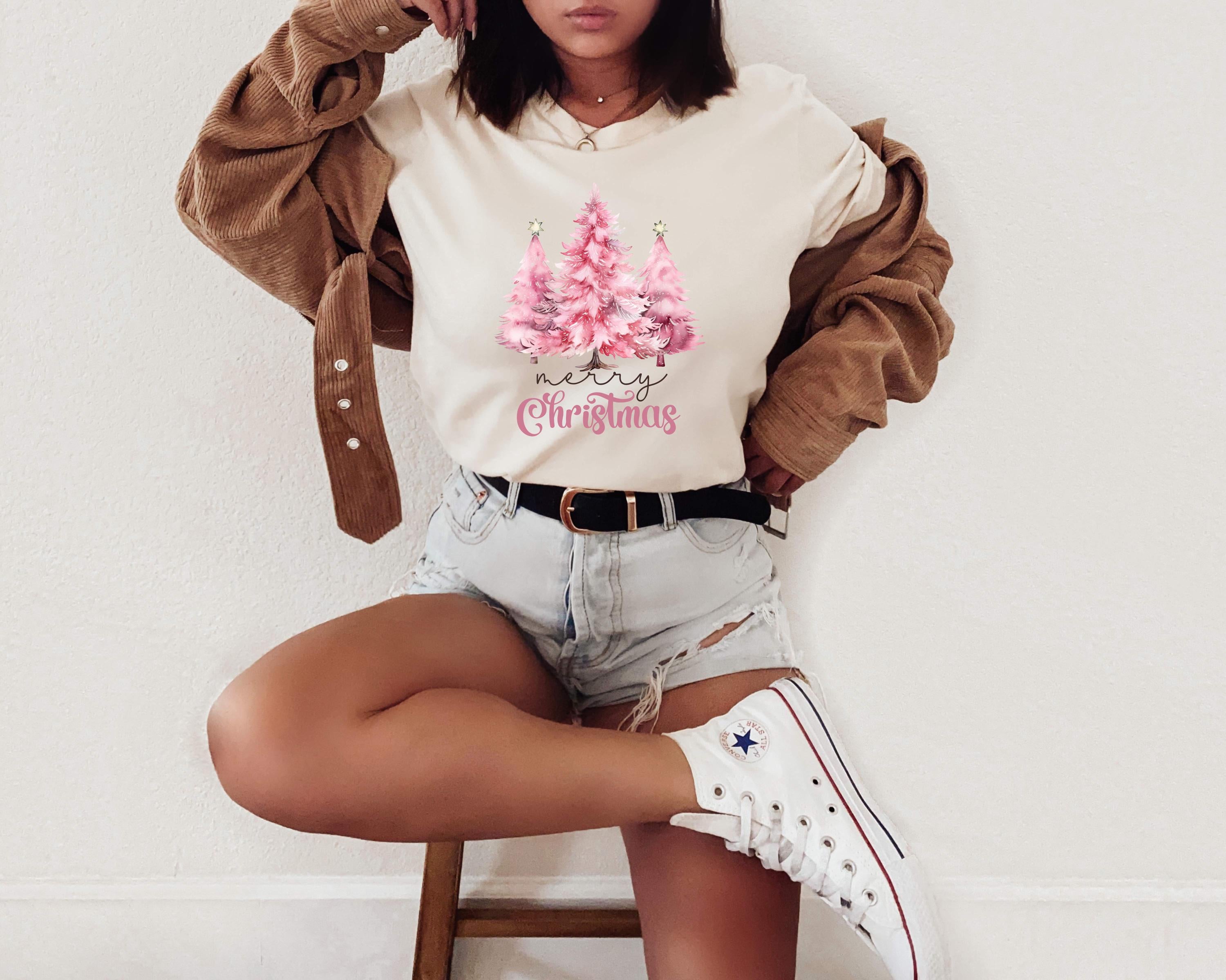 a woman sitting on top of a wooden stool