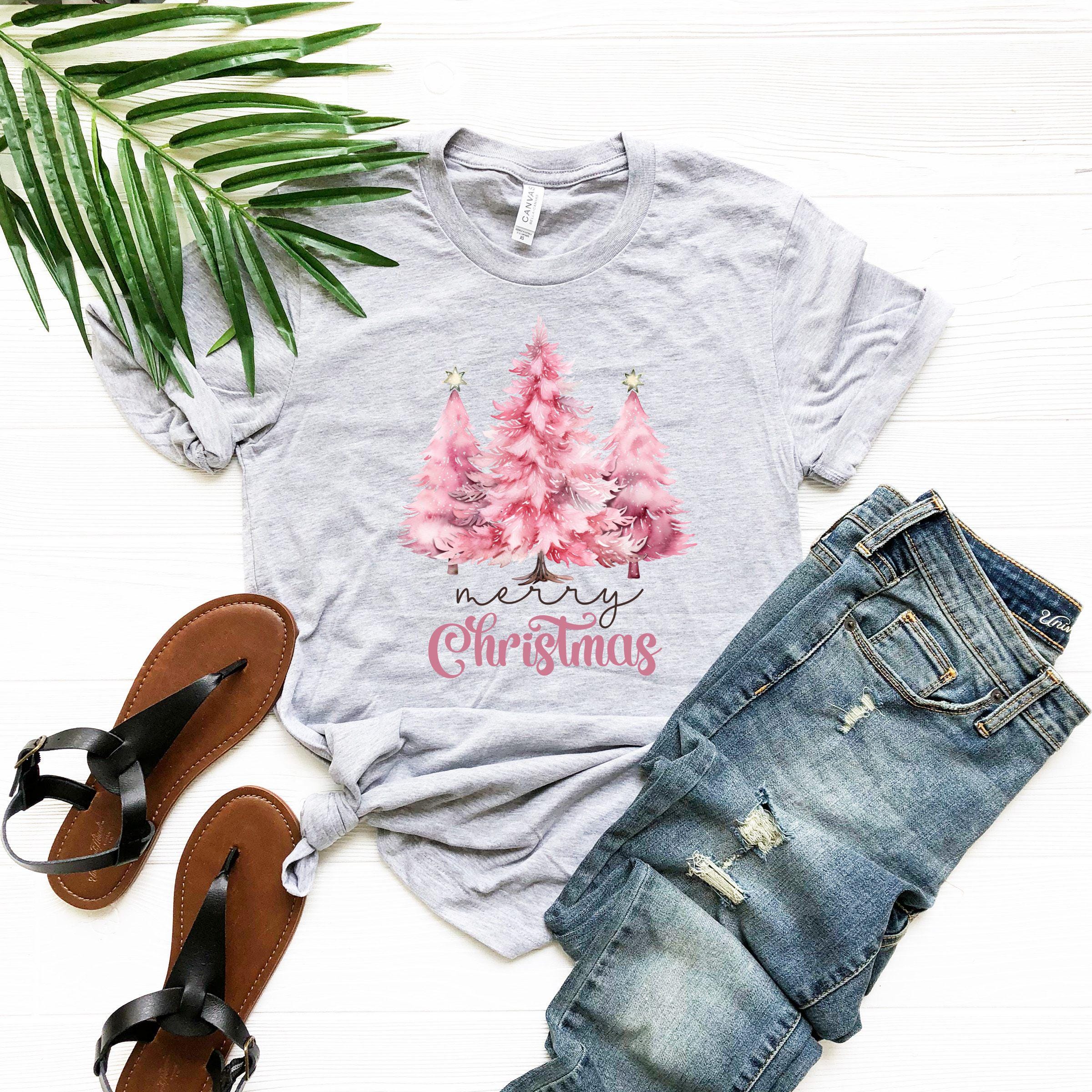 a t - shirt that says merry christmas with pink trees