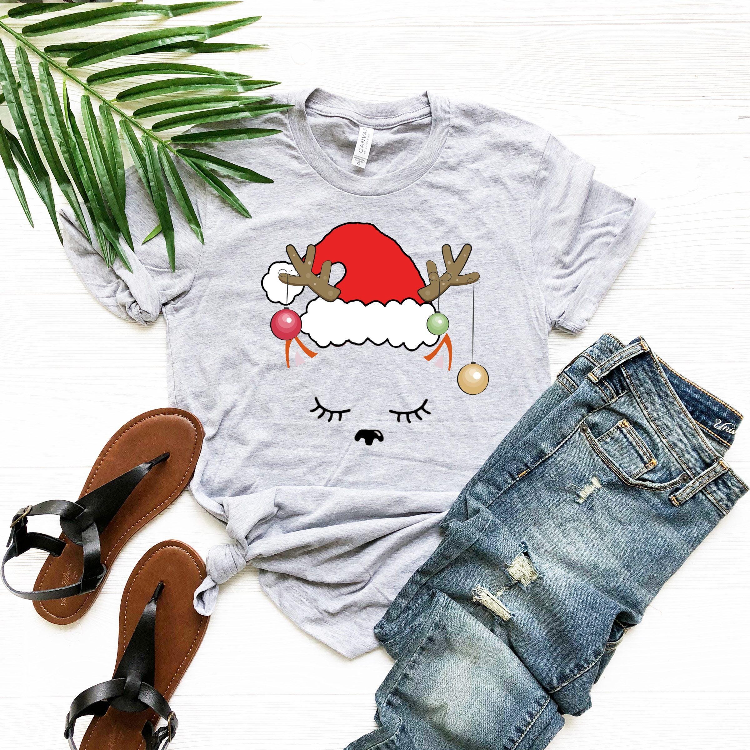 a t - shirt with a santa hat on it