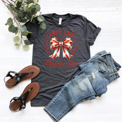 a t - shirt with a bow and a pair of jeans