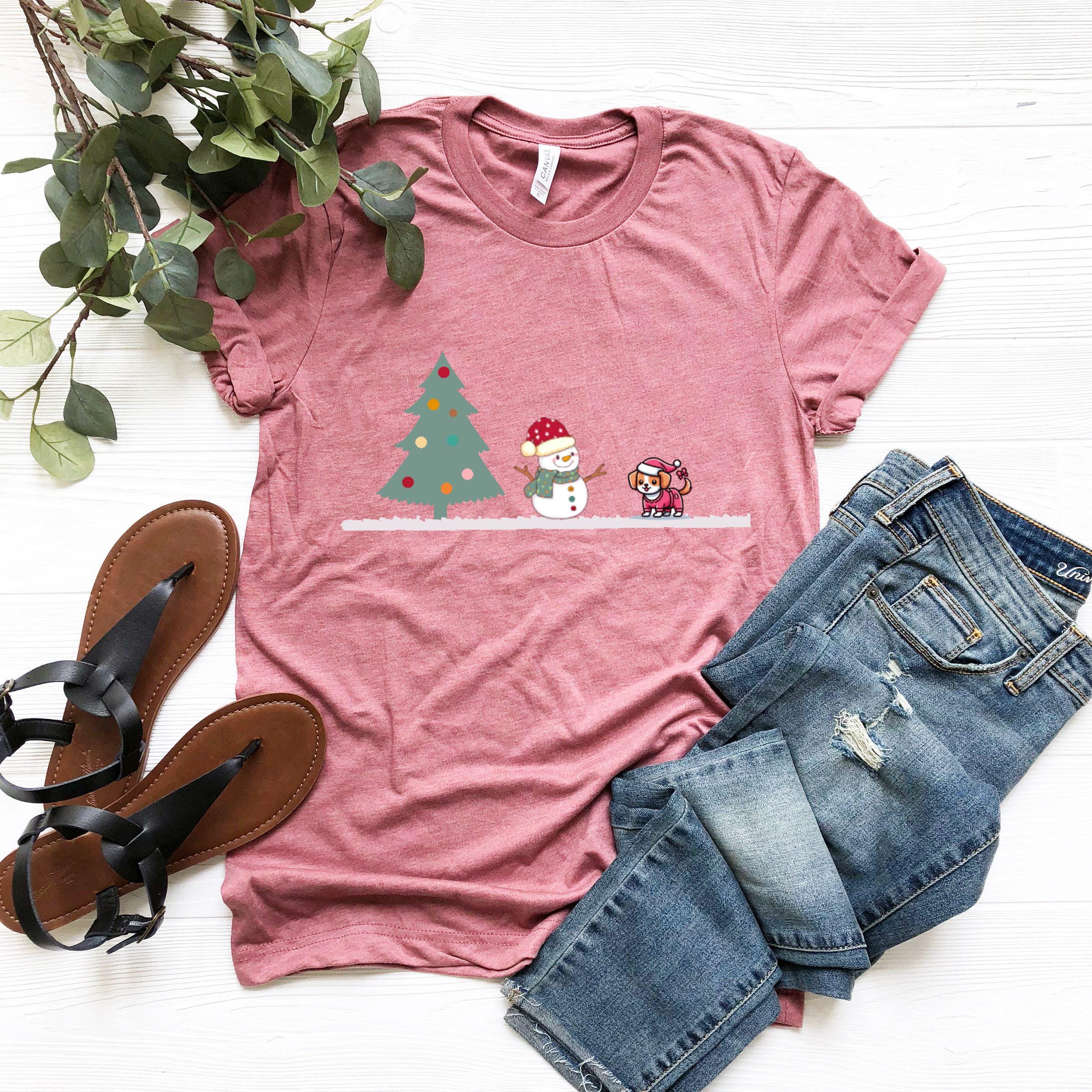 a t - shirt with a snowman and a christmas tree on it