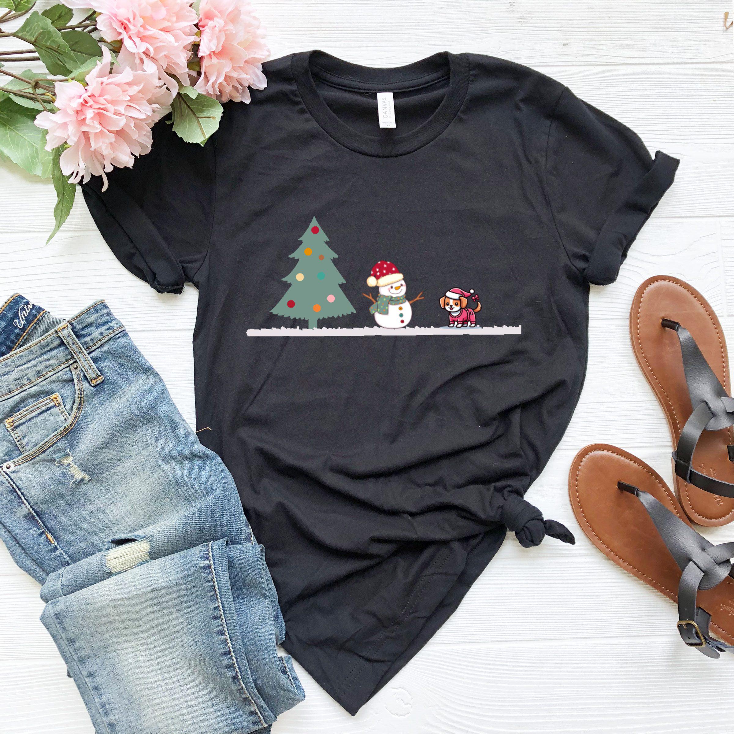 a t - shirt with a snowman and christmas trees on it